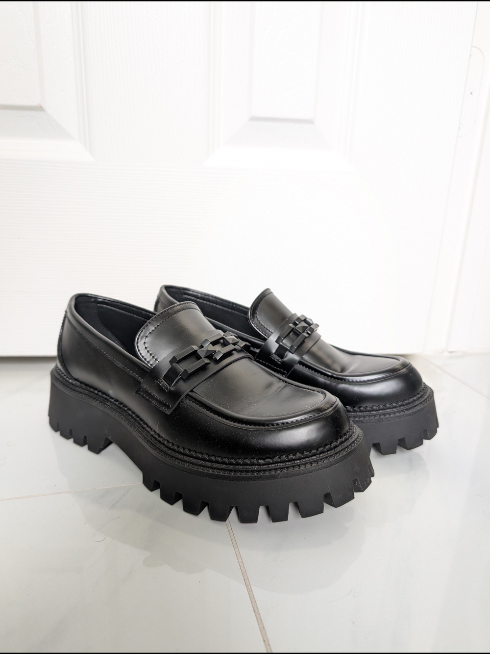 Steve Madden's Black Chunky Lug Sole Penny Loafers